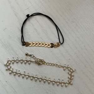 Bracelets. Set of 2  Gold arrow pattern and elastic band.  Delicate white beads